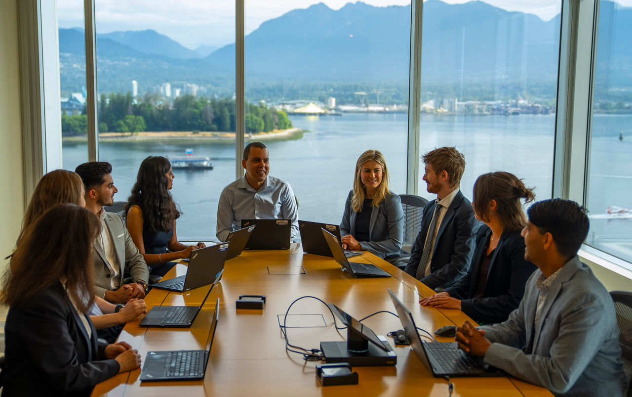 People standing around desk